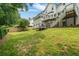 Beautifully landscaped backyard with a deck and lush green lawn, providing a serene outdoor living space at 340 Chandler Ct, Sugar Hill, GA 30518
