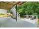 Back deck with staircase leading to yard, surrounded by lush greenery offering a serene outdoor setting at 340 Chandler Ct, Sugar Hill, GA 30518