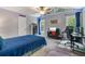 Well-lit bedroom with a ceiling fan, blue lighting accents, and a comfortable-looking bed at 340 Chandler Ct, Sugar Hill, GA 30518