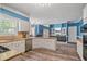 Spacious open concept kitchen with stainless appliances, white cabinets, granite countertops, and wood floors at 340 Chandler Ct, Sugar Hill, GA 30518