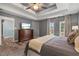 Main bedroom with ensuite bathroom has gray walls, carpet, and trey ceilings at 340 Chandler Ct, Sugar Hill, GA 30518