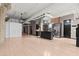 Open-concept kitchen and living area featuring concrete pillars and modern, stainless steel appliances at 434 Marietta Nw St # 301, Atlanta, GA 30313