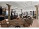 Spacious living room featuring exposed brick, concrete pillars, dining area and modern kitchen at 434 Marietta Nw St # 301, Atlanta, GA 30313