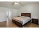 Comfortable bedroom features a ceiling fan, hardwood floors, and an ensuite bathroom at 6 Water View Dr, Stockbridge, GA 30281