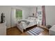Bright bedroom with hardwood floors, natural light, and neutral décor at 6 Water View Dr, Stockbridge, GA 30281