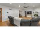Cozy living room featuring a fireplace, ceiling fan, recessed lighting, and wood laminate flooring at 6 Water View Dr, Stockbridge, GA 30281