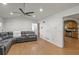 Spacious living room with laminate floors, a ceiling fan and a light neutral color palette at 6 Water View Dr, Stockbridge, GA 30281
