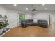 Open-concept living room with laminate floors, a fireplace, and ample natural light at 6 Water View Dr, Stockbridge, GA 30281