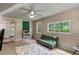 Bright sun room with many windows, ceiling fan, and open space at 6 Water View Dr, Stockbridge, GA 30281