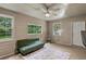 Bright sun room with many windows, ceiling fan, and an additional AC unit at 6 Water View Dr, Stockbridge, GA 30281