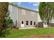 Backyard of a two-story home featuring a patio and a lawn at 113 Priestwood Ln, Acworth, GA 30102