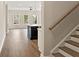 View of open living space with kitchen island and staircase with wood railing at 113 Priestwood Ln, Acworth, GA 30102