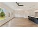 Open concept living space with lots of natural light and wood flooring at 113 Priestwood Ln, Acworth, GA 30102