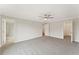 Spacious main bedroom with neutral carpet, ceiling fan, and ensuite bathroom and walk-in closet entrances at 113 Priestwood Ln, Acworth, GA 30102
