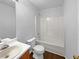 Well-lit bathroom featuring a vanity sink, toilet, and a combined shower-tub unit for essential comfort at 2397 Charleston Ter, Decatur, GA 30034