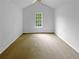 Bright bedroom with a large window and vaulted ceiling featuring a ceiling fan at 2397 Charleston Ter, Decatur, GA 30034