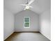 Bright bedroom with a large window and vaulted ceiling featuring a ceiling fan at 2397 Charleston Ter, Decatur, GA 30034