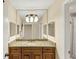 Bathroom featuring a granite counter top and a big mirror with good lighting at 30 Chaumont Nw Sq, Atlanta, GA 30327