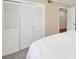 Bedroom with built in wardrobe closet with white doors and view of attached bedroom at 30 Chaumont Nw Sq, Atlanta, GA 30327