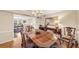 Elegant dining room with hardwood floors, chandelier, and view into living room at 30 Chaumont Nw Sq, Atlanta, GA 30327