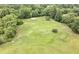 Lush green golf course surrounded by mature trees at 30 Chaumont Nw Sq, Atlanta, GA 30327