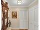 Inviting hallway with hardwood floors, coat rack, and neutral paint, leading to other rooms at 30 Chaumont Nw Sq, Atlanta, GA 30327