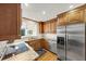 Well-equipped kitchen features stainless steel appliances, granite countertops, and warm wood cabinetry at 30 Chaumont Nw Sq, Atlanta, GA 30327