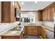 Granite countertops, stainless appliances and wood cabinets highlight this kitchen's character and functionality at 30 Chaumont Nw Sq, Atlanta, GA 30327