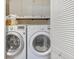 Laundry area with closet, LG front load washer and dryer, and cabinets at 30 Chaumont Nw Sq, Atlanta, GA 30327