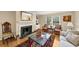 Cozy living room featuring a fireplace with decorative mantle, complemented by hardwood floors and comfortable seating at 30 Chaumont Nw Sq, Atlanta, GA 30327