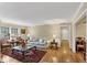 Bright living room featuring hardwood floors, neutral walls, and a cozy seating arrangement at 30 Chaumont Nw Sq, Atlanta, GA 30327