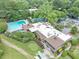 Aerial view of clubhouse with pool, tennis court and parking at 30 Chaumont Nw Sq, Atlanta, GA 30327