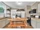 Kitchen featuring stainless steel appliances, floating shelves, and butcher block countertops at 575 E Main St, Buford, GA 30518