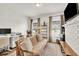 Bright living room features a comfortable couch, desk area, and white brick fireplace at 575 E Main St, Buford, GA 30518