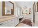 Elegant bathroom featuring a soaking tub, double vanity, and decorative mirrors at 585 Old Cobblestone Dr, Atlanta, GA 30350