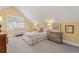 Sunny bedroom with yellow walls, a crib, and neutral carpet at 585 Old Cobblestone Dr, Atlanta, GA 30350