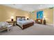 Serene bedroom with neutral tones, ample lighting, and cozy seating for relaxing and unwinding at 585 Old Cobblestone Dr, Atlanta, GA 30350