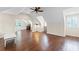 Open bonus room with hardwood floors, ceiling fan, and natural light at 585 Old Cobblestone Dr, Atlanta, GA 30350