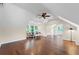 Open bonus room featuring hardwood floors and a ceiling fan at 585 Old Cobblestone Dr, Atlanta, GA 30350