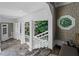 Hallway with unique stone floors and an octagonal window at 585 Old Cobblestone Dr, Atlanta, GA 30350