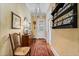 The hallway with vintage wallpaper features wooden accents, and vintage furniture at 585 Old Cobblestone Dr, Atlanta, GA 30350