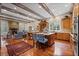 Well-lit kitchen featuring wood beams, spacious cabinets, and seating at 585 Old Cobblestone Dr, Atlanta, GA 30350