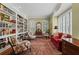 Cozy living room with built-in bookshelves, plush seating, and natural light creates a relaxing atmosphere at 585 Old Cobblestone Dr, Atlanta, GA 30350