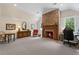 Bright room features a fireplace, desk, and lots of natural light at 585 Old Cobblestone Dr, Atlanta, GA 30350