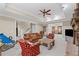 Spacious living room with fireplace and ceiling fan, perfect for relaxation and entertainment at 585 Old Cobblestone Dr, Atlanta, GA 30350