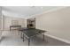 Well-lit recreation room featuring a ping pong table, offering a perfect space for entertainment at 585 Old Cobblestone Dr, Atlanta, GA 30350