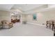 Open recreation room with access to a living room, offering flexible space for various activities at 585 Old Cobblestone Dr, Atlanta, GA 30350