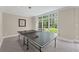 Recreation room with a ping pong table and view to the backyard, perfect for indoor and outdoor enjoyment at 585 Old Cobblestone Dr, Atlanta, GA 30350