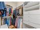Walk-in closet featuring custom shelving, drawers, and hanging space at 585 Old Cobblestone Dr, Atlanta, GA 30350