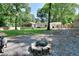 Fire pit feature in spacious backyard with mature trees and a cozy, inviting atmosphere at 1379 Branchwood Dr, Snellville, GA 30078
